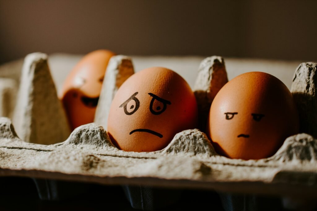 How A Thoughtful Website Can Ground Your Vision image: there are two eggs in a carton, one has a worried face, and the other has a grumpy face